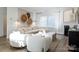 Cozy living room features neutral colors, modern decor, and large windows that provide plenty of natural light at 14015 Penbury Ln # 373, Charlotte, NC 28278