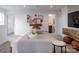 Cozy living room with a neutral sectional couch and modern decor at 14015 Penbury Ln # 373, Charlotte, NC 28278
