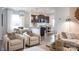 Contemporary living room boasts stylish furnishings, a sleek fireplace, and plenty of seating for relaxation and entertainment at 14015 Penbury Ln # 373, Charlotte, NC 28278