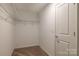 Walk-in closet with wire shelving and a neutral carpet at 14015 Penbury Ln # 373, Charlotte, NC 28278