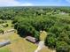 Wide aerial view of a mobile home surrounded by trees and community at 145 Mccreek Dr, China Grove, NC 28023