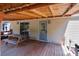Inviting back deck featuring an outdoor seating area and access to the home through a sliding glass door at 145 Mccreek Dr, China Grove, NC 28023
