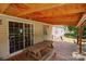 Back porch featuring a picnic table and sliding glass doors leading to the house at 145 Mccreek Dr, China Grove, NC 28023