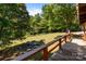 Backyard view from the back deck, showing the lush greenery and trees at 145 Mccreek Dr, China Grove, NC 28023