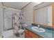 Bathroom featuring a shower with curtain, toilet, sink and vanity at 145 Mccreek Dr, China Grove, NC 28023