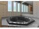 Close-up of the corner jacuzzi bathtub, showing the jets and hardware at 145 Mccreek Dr, China Grove, NC 28023