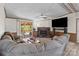 Spacious living room featuring a stone fireplace, plush seating and sliding glass door access to the deck at 145 Mccreek Dr, China Grove, NC 28023