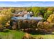 Stunning aerial view of a historic building surrounded by lush greenery and mature trees at 155 Harper Lee St, Davidson, NC 28036