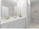 Bathroom with white cabinetry, countertop, a toilet and shower behind a door at 155 Harper Lee St, Davidson, NC 28036