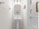 Half bath with pedestal sink and decorative mirror at 155 Harper Lee St, Davidson, NC 28036