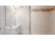 Well-lit bathroom featuring double sinks, decorative tile, and a glass-enclosed shower at 155 Harper Lee St, Davidson, NC 28036
