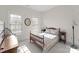 Bedroom with furniture, including a wooden bed with matching nightstands and lots of sunlight at 155 Harper Lee St, Davidson, NC 28036