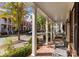 Inviting front porch with classic columns and outdoor seating, perfect for relaxing at 155 Harper Lee St, Davidson, NC 28036