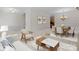 Cozy living space showcases a comfortable chair, coffee table, and a dining area with a chandelier at 155 Harper Lee St, Davidson, NC 28036