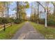 Scenic path along the South Prong Rocky River Greenway, surrounded by lush trees at 155 Harper Lee St, Davidson, NC 28036