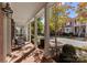 Inviting covered porch features classic columns and a relaxing outdoor seating area at 155 Harper Lee St, Davidson, NC 28036