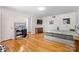 Spacious bedroom with hardwood floors, gray bed, vanity, and television, offering comfort and convenience at 1574 Jarrett Farm Rd, Newton, NC 28658