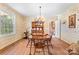 Charming dining room with floral wallpaper and chandelier lighting at 1574 Jarrett Farm Rd, Newton, NC 28658