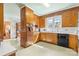 Full kitchen with built in oven, light green flooring, and view of yard at 1574 Jarrett Farm Rd, Newton, NC 28658