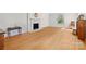 Bright living room featuring wood floors, fireplace, and natural light at 1574 Jarrett Farm Rd, Newton, NC 28658