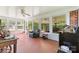 Sunroom with red tile, lots of natural light and furniture at 1574 Jarrett Farm Rd, Newton, NC 28658