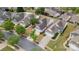 Aerial view showcases the neighborhood with well-maintained lawns and tree-lined streets at 16291 Raven Crest Dr, Indian Land, SC 29707
