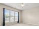 This bedroom offers plush carpet, neutral paint, a ceiling fan, and a bright window at 16291 Raven Crest Dr, Indian Land, SC 29707