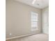 This bedroom offers neutral walls, plush carpet, a window, and a ceiling fan at 16291 Raven Crest Dr, Indian Land, SC 29707