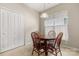Cozy breakfast nook featuring a wooden table, tile floors, and a bright window at 16291 Raven Crest Dr, Indian Land, SC 29707