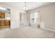 Bright dining room features neutral walls, chandelier, and a large window with natural light at 16291 Raven Crest Dr, Indian Land, SC 29707