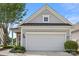 Garage area with neatly trimmed bushes at 16291 Raven Crest Dr, Indian Land, SC 29707