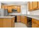 Updated kitchen features stainless steel appliances, gray counters, and custom cabinets at 16291 Raven Crest Dr, Indian Land, SC 29707