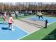 Active pickleball courts with players in action, perfect for social and recreational enjoyment at 16291 Raven Crest Dr, Indian Land, SC 29707