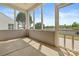 View of a screened porch featuring a concrete floor, framed views, and sunlit surroundings at 16291 Raven Crest Dr, Indian Land, SC 29707