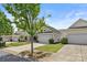 Street view showcasing homes and well-kept lawns and driveways at 16291 Raven Crest Dr, Indian Land, SC 29707