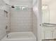 Bright bathroom featuring a tiled shower-tub with a neutral color palette and a decorative nook at 16319 Ashlyn Chase Ct, Charlotte, NC 28277