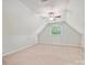 Attic bonus room featuring dormer window, neutral color palette, and recessed ceiling fan light at 16319 Ashlyn Chase Ct, Charlotte, NC 28277