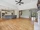 Bright, open living room featuring hardwood floors and views into the kitchen at 16319 Ashlyn Chase Ct, Charlotte, NC 28277