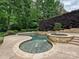 Custom pool featuring a spillover spa and stone surround is perfect for relaxing or entertaining at 16319 Ashlyn Chase Ct, Charlotte, NC 28277