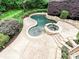 Aerial view of the custom pool, spa, and surrounding patio area surrounded by manicured landscaping at 16319 Ashlyn Chase Ct, Charlotte, NC 28277