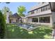 Stunning backyard with a modern pool, green lawn, and elegant outdoor living spaces at 1719 Shoreham Dr, Charlotte, NC 28211