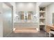 Luxury bathroom featuring double sinks, elegant mirrors, and a frameless glass shower at 1719 Shoreham Dr, Charlotte, NC 28211