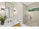 Modern bathroom with a glass-enclosed shower, sleek vanity, and stylish fixtures at 1719 Shoreham Dr, Charlotte, NC 28211