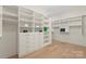 Walk-in closet with custom shelving, ample storage, and organized layout at 1719 Shoreham Dr, Charlotte, NC 28211
