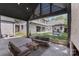 Charming covered patio with comfortable seating and elegant stone flooring, perfect for outdoor relaxation at 1719 Shoreham Dr, Charlotte, NC 28211