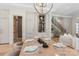 Dining area featuring staircase, sleek bar, and modern furnishings at 1719 Shoreham Dr, Charlotte, NC 28211