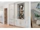 Custom dry bar featuring ambient lighting and glass shelves at 1719 Shoreham Dr, Charlotte, NC 28211