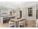 Modern kitchen and dining area with stainless steel appliances, pendant lighting, and sleek countertops at 1719 Shoreham Dr, Charlotte, NC 28211