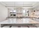 Spacious kitchen with modern appliances, marble countertops, and pendant lights at 1719 Shoreham Dr, Charlotte, NC 28211