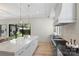Bright kitchen features marble countertops, stainless appliances, and a view of the backyard pool at 1719 Shoreham Dr, Charlotte, NC 28211